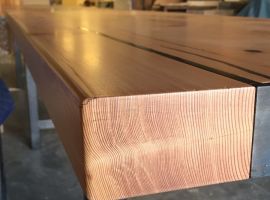 Detail of 20' long table for Tacoma Restaurant, The Table. Douglas Fir and Blackened Steel